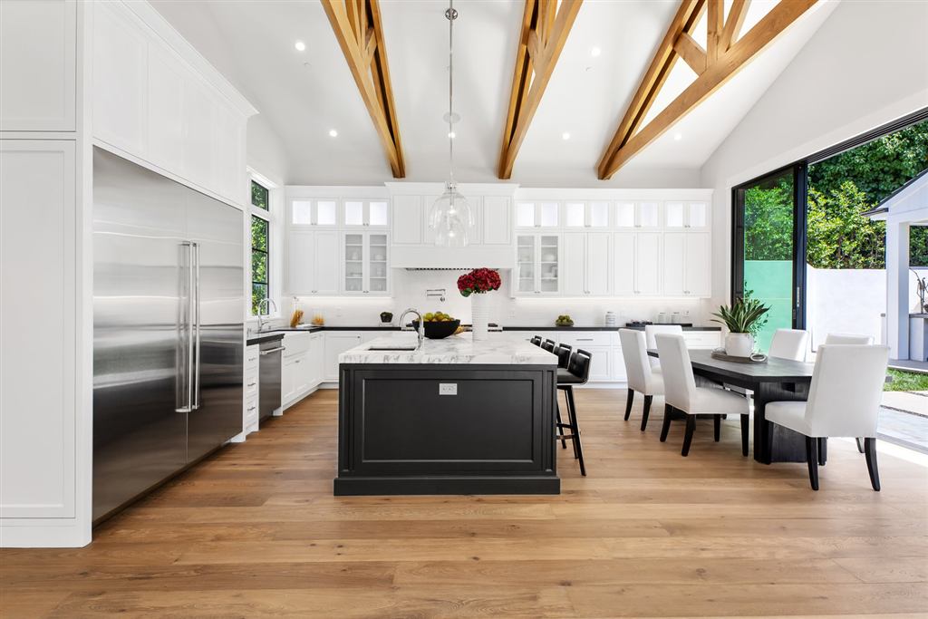 Kitchen with exposed wood trusses and black steel-framed windows, Bel-Air new construction
