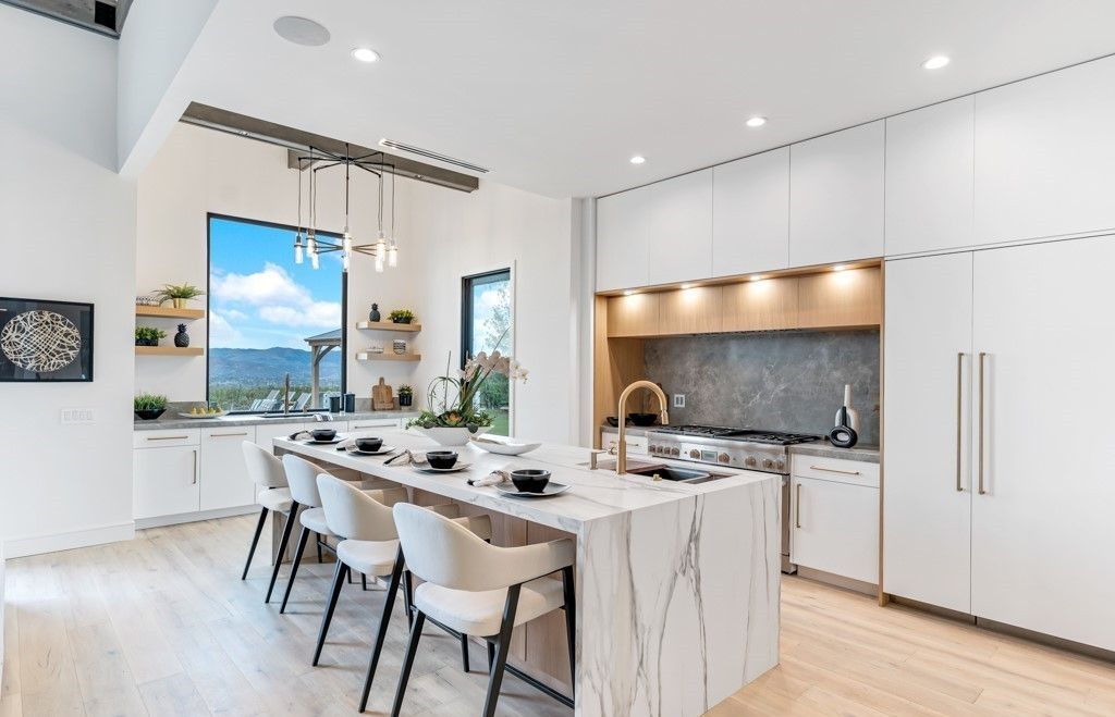 Kitchen with aluminum-clad windows framing mountain views, Calabasas remodel