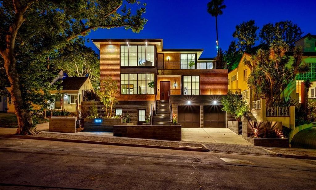 Cheviot Hills modern new construction front exterior at twilight with cedar siding and dark aluminum windows