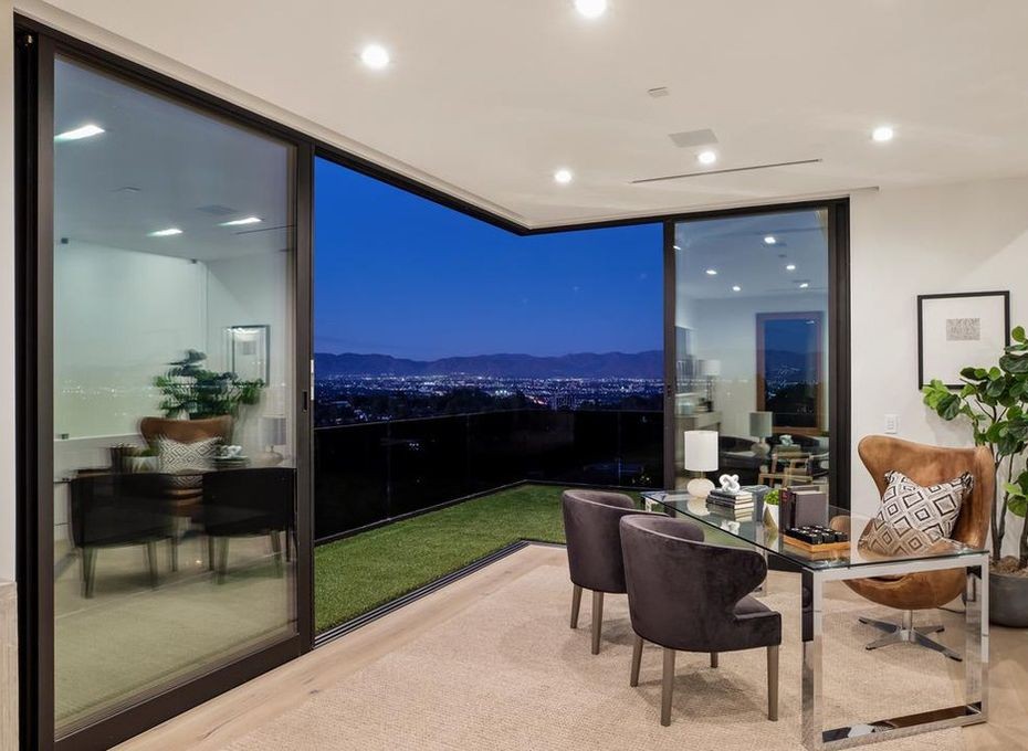 Dining area in Encino framed by a glazed corner in Arcadia aluminum, looking out to the San Fernando Valley