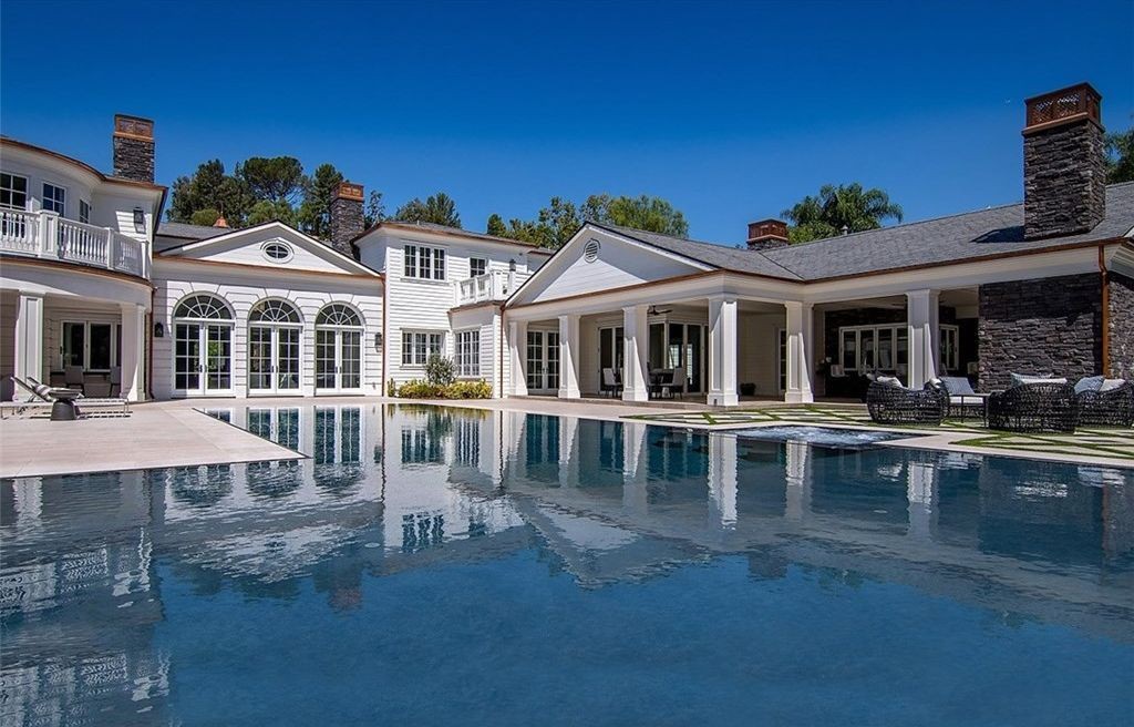 Rear elevation with arched French doors and infinity pool, Hidden Hills new construction