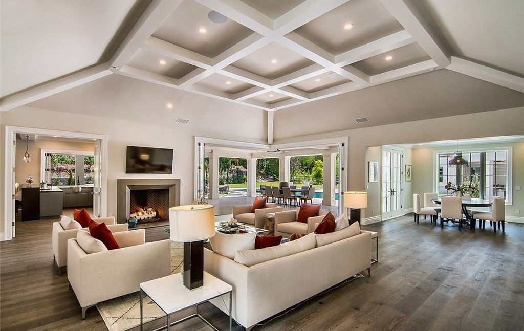 Great room with coffered ceiling and folding glass doors opening to the backyard, Hidden Hills