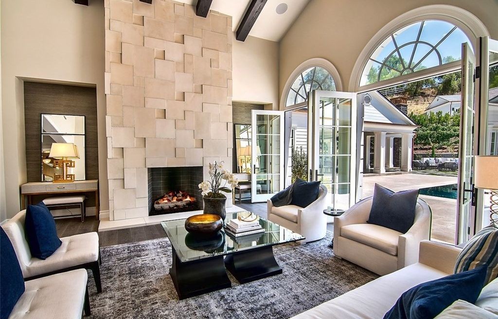 Living room with arched French doors opening to the pool deck, Hidden Hills