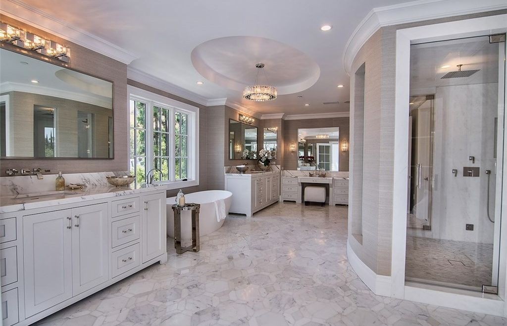 Marble primary bathroom with aluminum-clad casement window, Hidden Hills