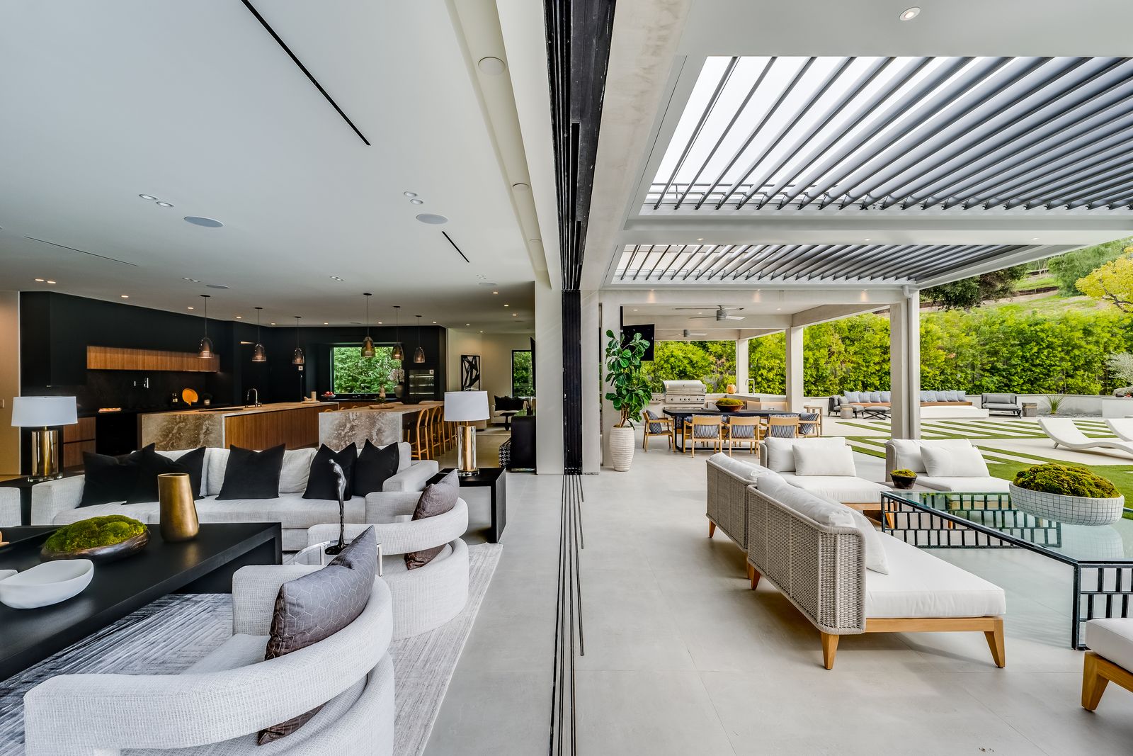 Great room opening through sliding glass doors to a covered patio, Woodland Hills remodel