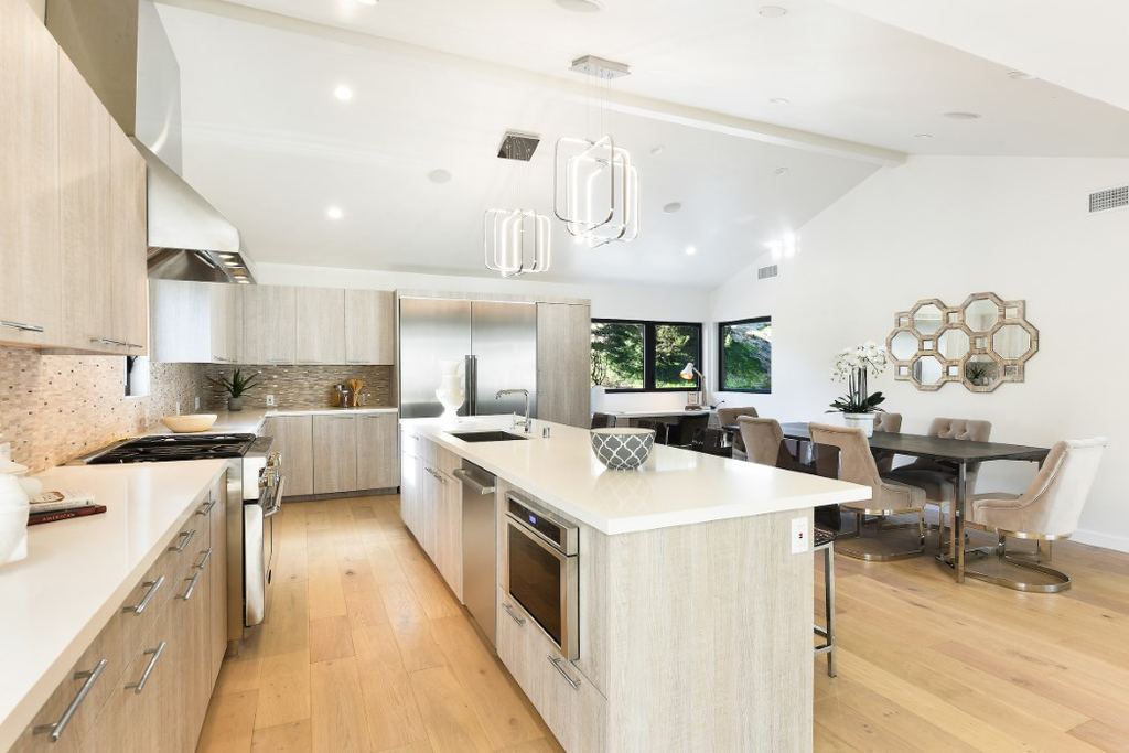 Kitchen and dining area with black aluminum casement windows over the built-in desk nook, Los Feliz remodel