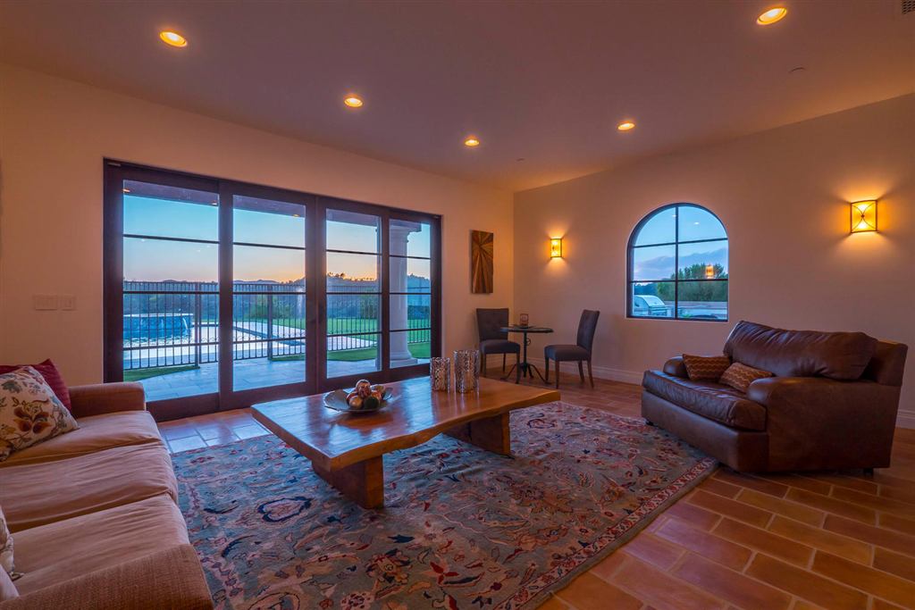 Family room with multi-panel aluminum sliding doors opening to the pool and patio, Topanga